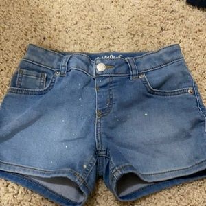 girls denim shorts with paint splatter- size 7/8